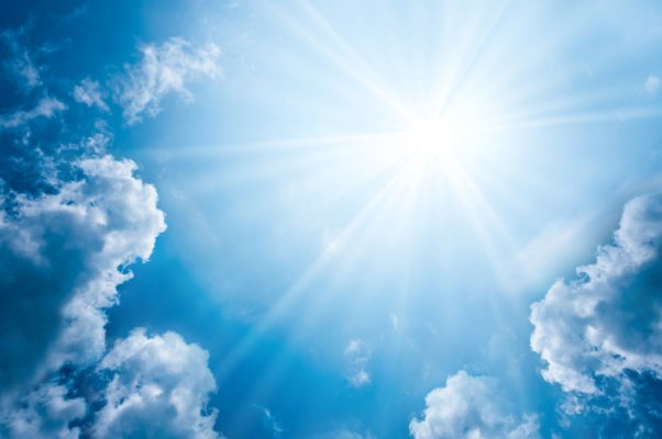 Radiant Sunlight Breaking Through Blue Sky