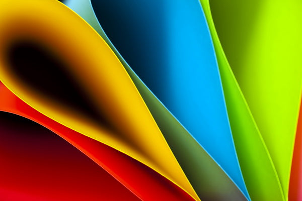 Curved Layers of Vibrant Colored Paper Sheets
