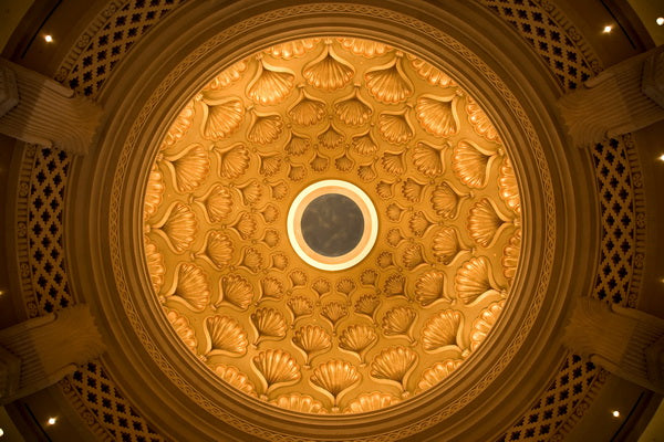 Ornate Ceiling: A Golden Dome with Intricate Shell Patterns