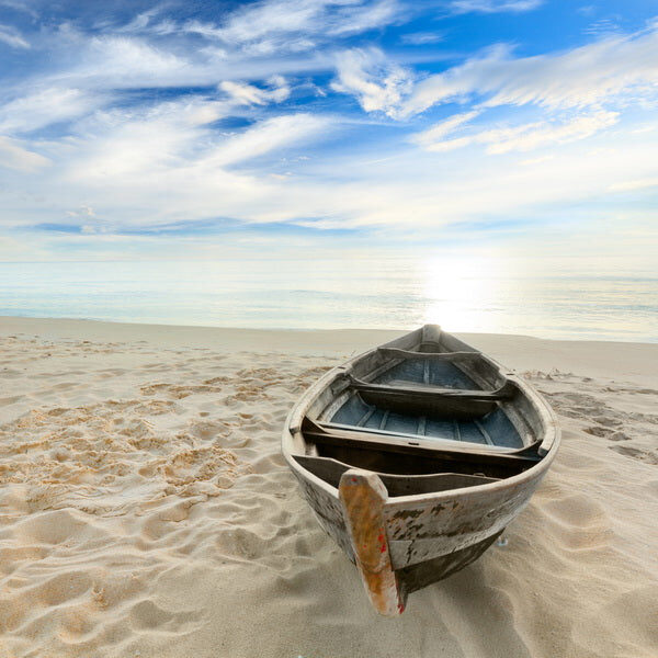 Abandoned Rowboat on a Tranquil Beach
