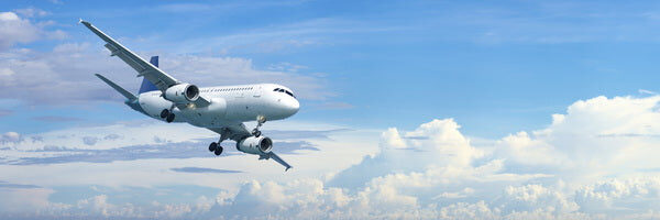 Airplane in Flight Above the Clouds
