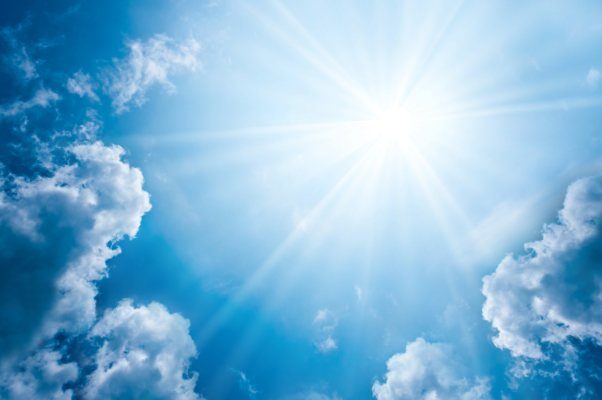 Radiant Sunlight Breaking Through Blue Sky