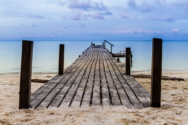 Serene Wooden Pier Leading to Calm Waters