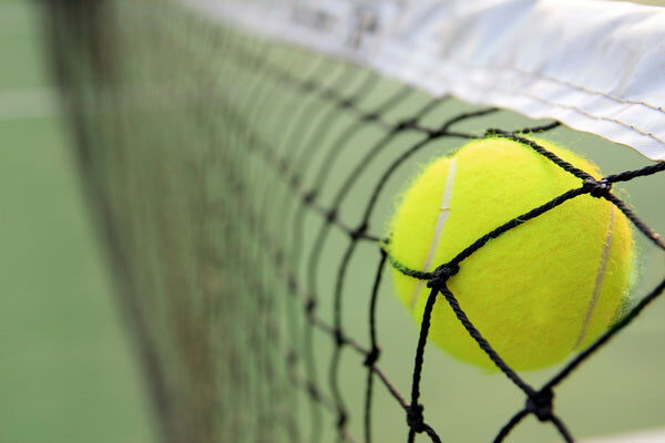 Tennis Ball Caught in the Net